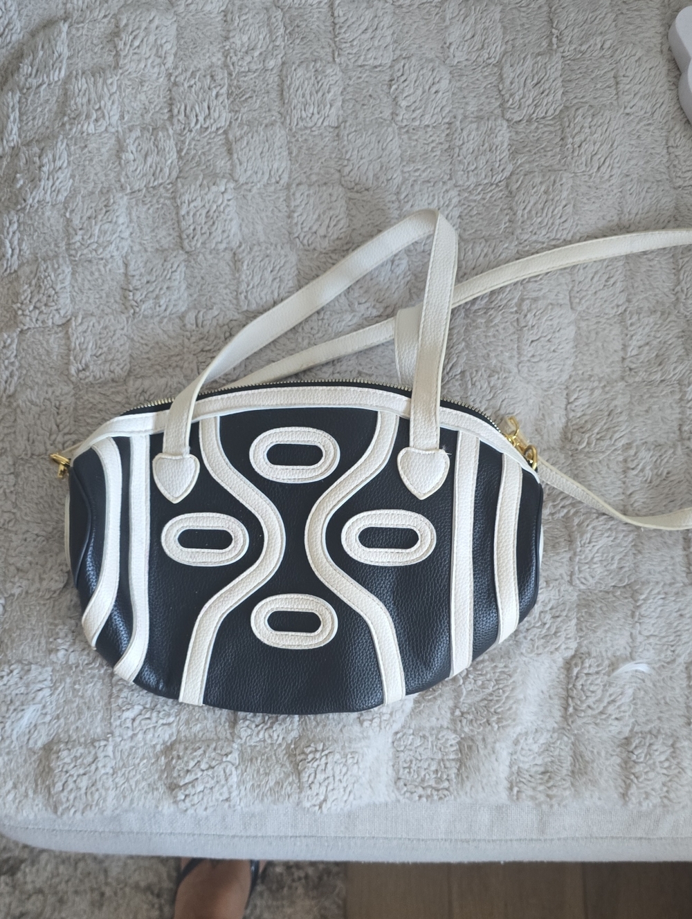 White and Black Textured Crossbody Bag by 15 Inches Long 9 1/2 Inches Deep.